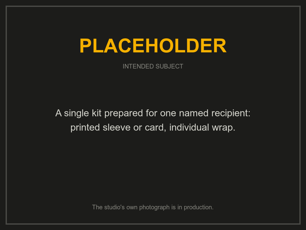 Placeholder: one kit prepared for a named recipient, with a printed sleeve and an individual wrap. The studio's own photograph is in production.