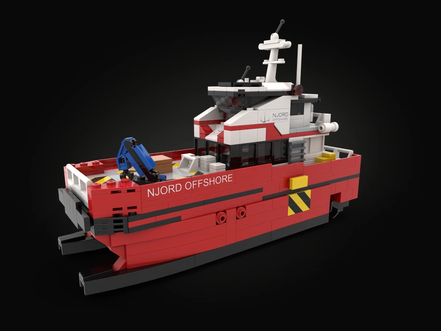 A red twin-hulled offshore speed vessel built from LEGO® bricks, NJORD OFFSHORE printed along the hull and on the white bridge, with a blue deck crane at the stern.